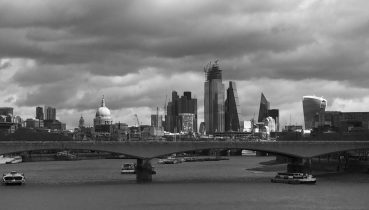 Black and white photo of the London Skyline, with the dome of St Paul's Cathedral lit with sunlight - Photo by illustrator Jonathan Chapman